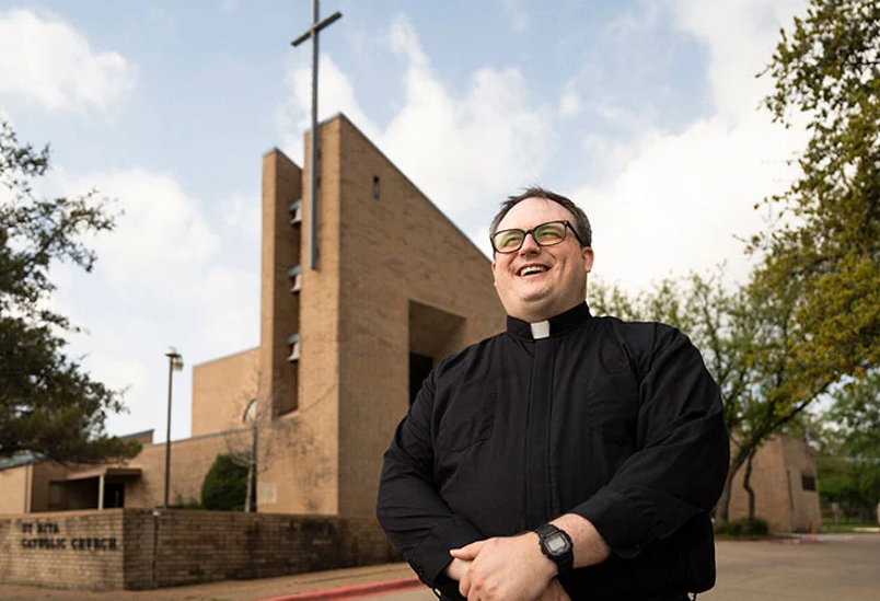 Fr. Hathaway in front of St. Rita Catholic Church